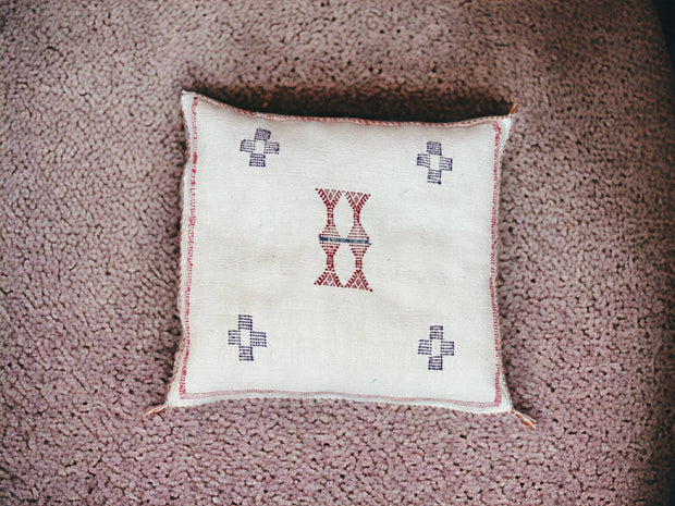 Handmade lumbar cushion with intricate Moroccan Sabra design, perfect for home decor.