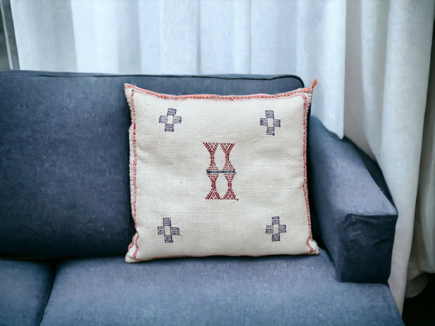 Handmade lumbar cushion with intricate Moroccan Sabra design, perfect for home decor.