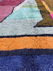 Close-up of a textured rug with multicolored stripes