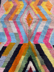 Handwoven Moroccan Bjaad carpet with bold geometric tribal design in multicolor wool, 247 × 164 cm