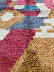 Handwoven Moroccan Bjaad carpet with abstract earth and rose geometric design in multicolor wool, 229 × 161 cm