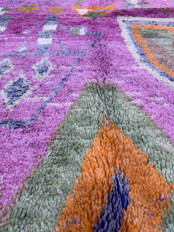 Handwoven Moroccan Bjaad carpet with blush pink geometric tribal motifs in multicolor wool, 269 × 147 cm
