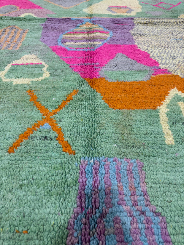 Handwoven Moroccan Bjaad carpet with abstract garden-inspired geometric motifs in multicolor wool, 250 × 150 cm