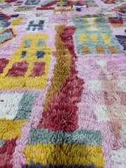 Handwoven Moroccan Bjaad carpet with vibrant pink medina-inspired geometric motifs in multicolor wool, 266 × 159 cm