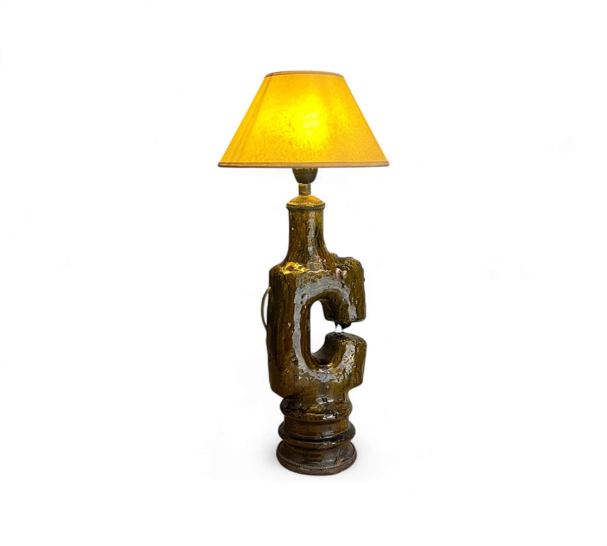 Decorative lamp with a yellow shade on a white background