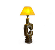 Decorative lamp with a yellow shade on a white background