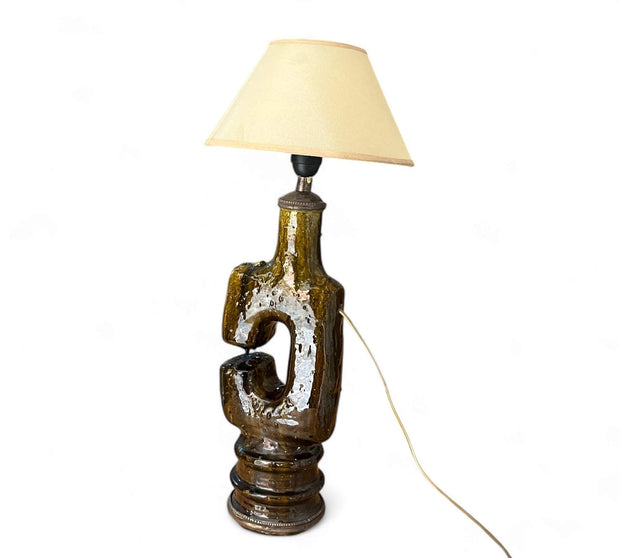 Decorative table lamp with a unique base on a white background