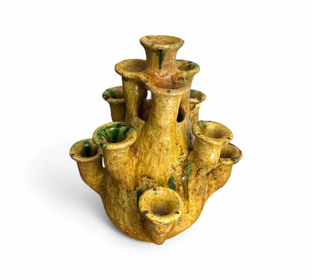 Yellow ceramic vase with multiple nozzles on a white background