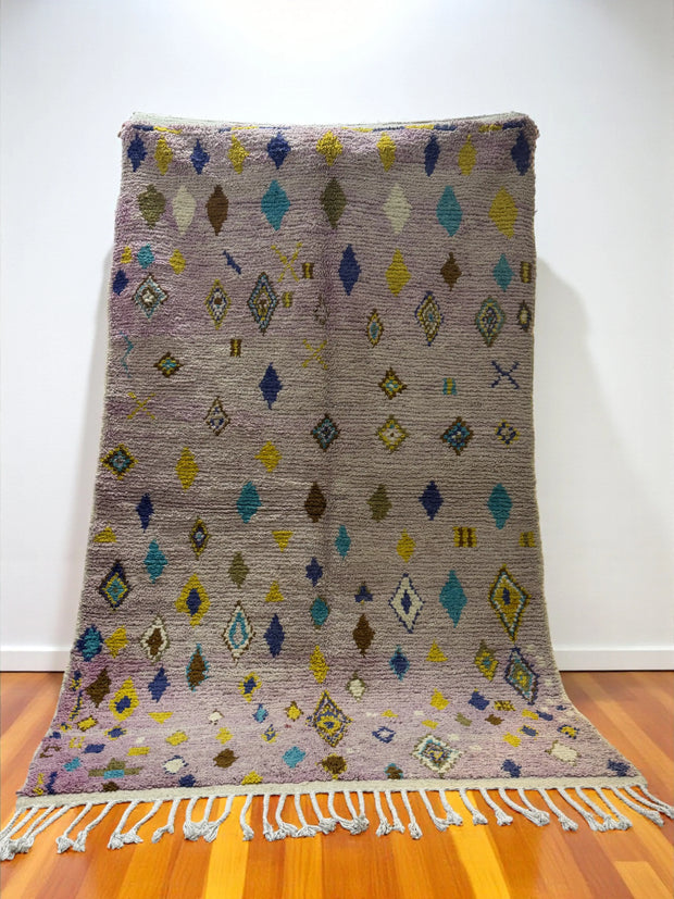 Handwoven Moroccan Bjaad carpet in lavender with diamond motifs and colorful accents, 249 × 154 cm