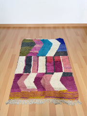 Handwoven Moroccan Bjaad carpet with bold chevron and color-block pattern in multicolor wool, 241 × 161 cm