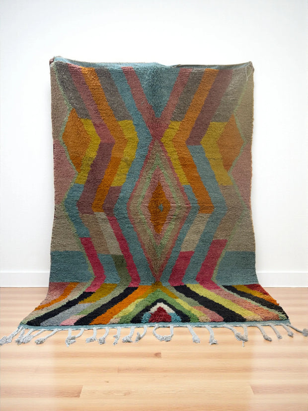 Handwoven Moroccan Bjaad carpet with bold geometric tribal design in multicolor wool, 247 × 164 cm