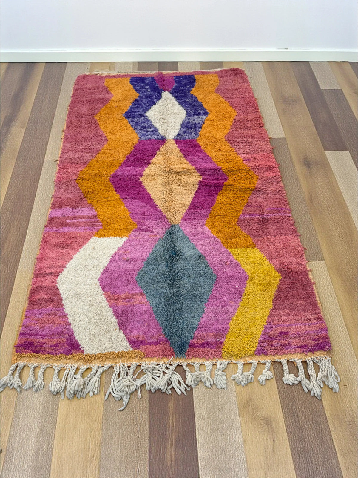 Handwoven Moroccan Bjaad carpet with geometric diamond and zigzag sunset pattern in multicolor wool, 267 × 163 cm