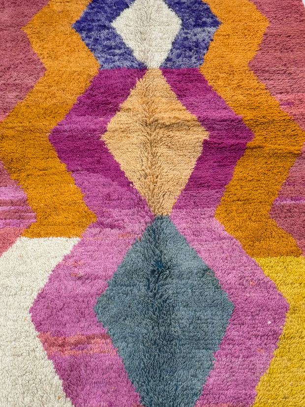 Colorful geometric patterned rug with vibrant colors