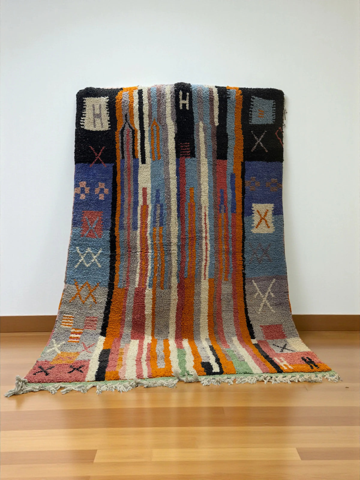 Handwoven Moroccan Bjaad carpet with abstract tribal striped design in multicolor wool, 242 × 166 cm