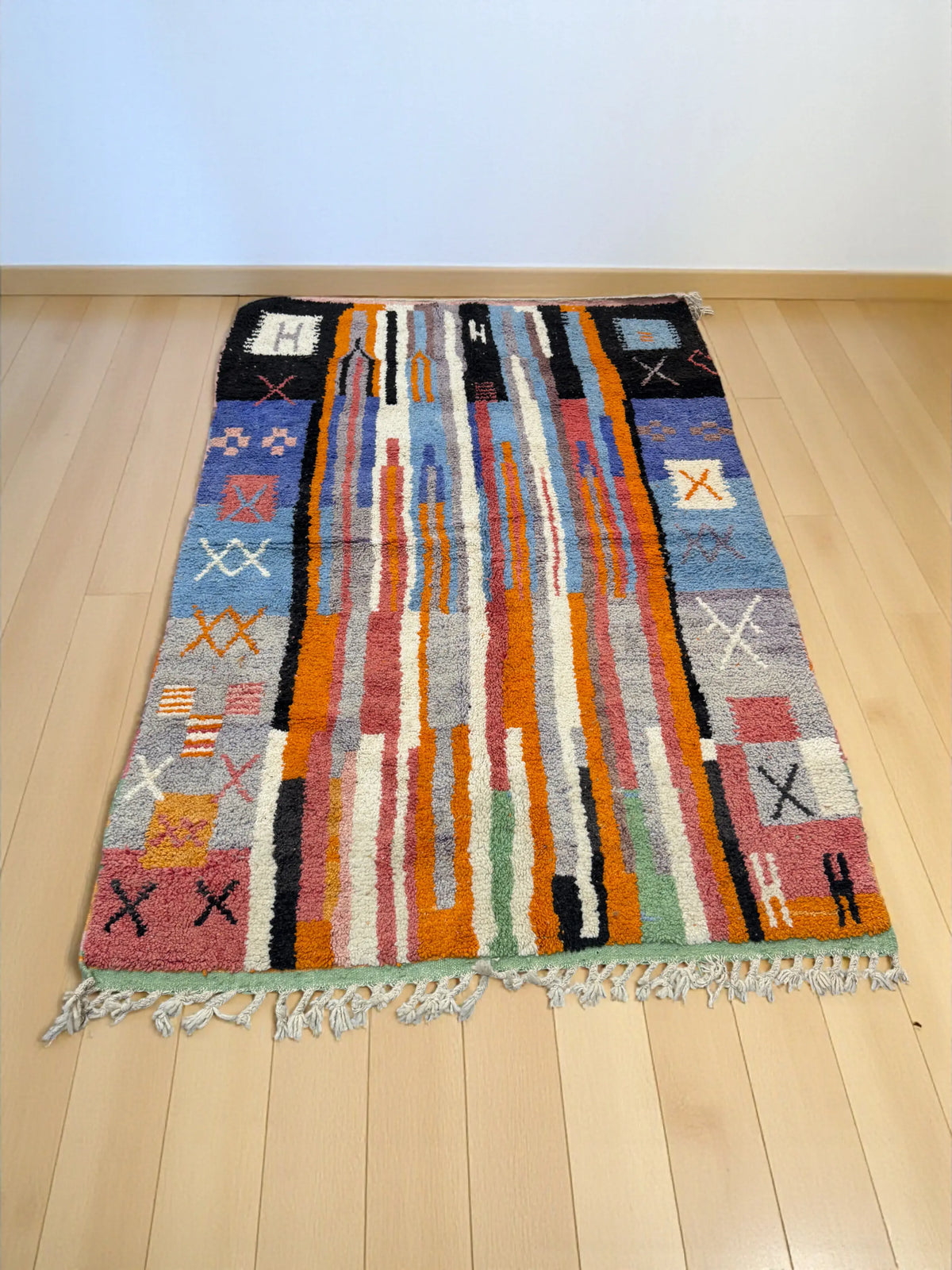 Handwoven Moroccan Bjaad carpet with abstract tribal striped design in multicolor wool, 242 × 166 cm