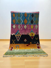 Handwoven Moroccan Bjaad carpet with tribal geometric motifs in multicolor wool, 264 × 151 cm