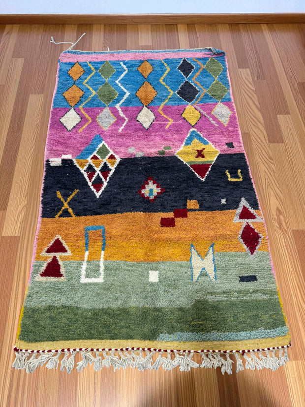 Handwoven Moroccan Bjaad carpet with tribal geometric motifs in multicolor wool, 264 × 151 cm