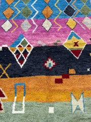 Colorful geometric patterned rug with various shapes and colors.