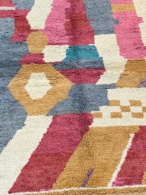 Handwoven Moroccan Bjaad carpet with abstract earth and rose geometric design in multicolor wool, 229 × 161 cm