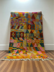 Handwoven Moroccan Bjaad carpet with kaleidoscope tribal geometric design in multicolor wool, 238 × 155 cm