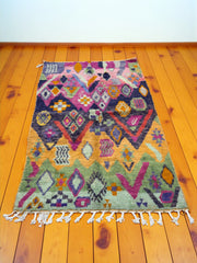 Handwoven Moroccan Bjaad carpet with tribal jewel geometric motifs in multicolor wool, 252 × 164 cm