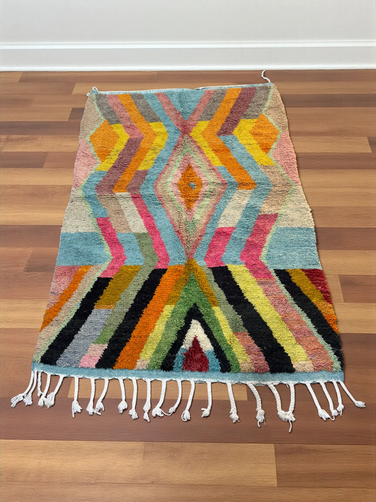 Handwoven Moroccan Bjaad carpet with bold geometric tribal design in multicolor wool, 247 × 164 cm