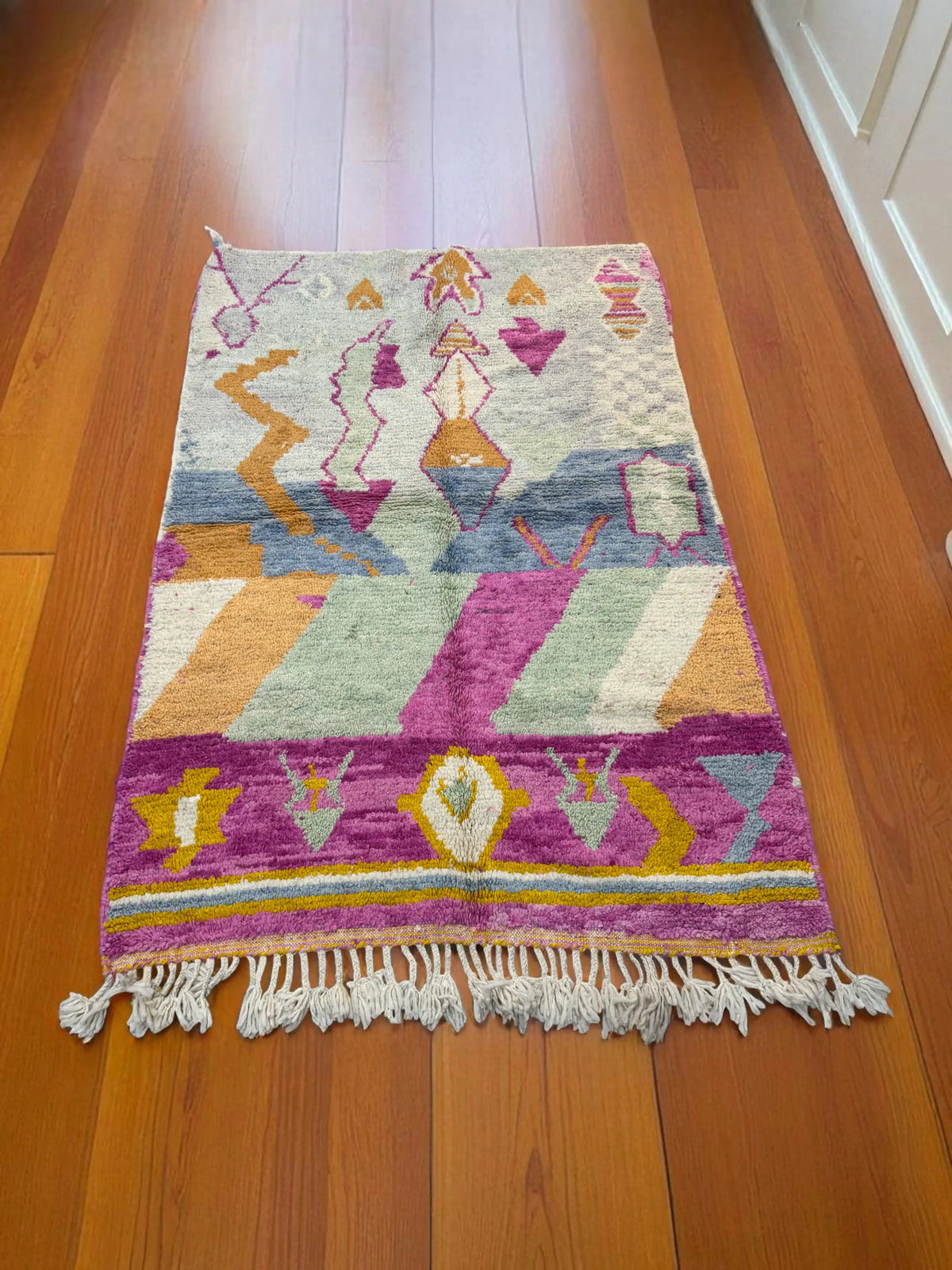 Handwoven Moroccan Bjaad carpet with soft tribal geometric design in multicolor wool, 244 × 160 cm