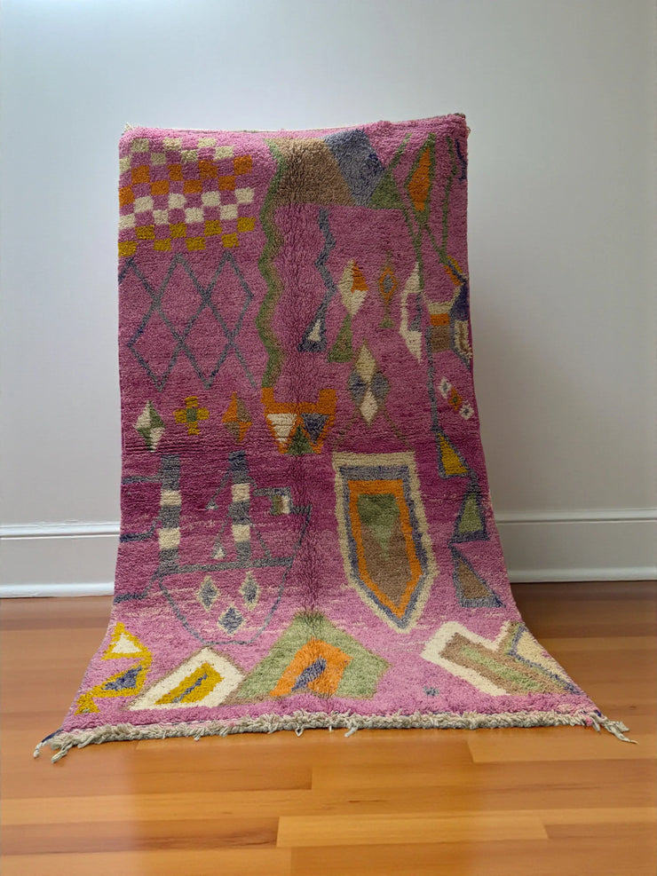 Handwoven Moroccan Bjaad carpet with blush pink geometric tribal motifs in multicolor wool, 269 × 147 cm