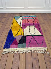 Handwoven Moroccan Bjaad carpet with abstract geometric architectural pattern in multicolor wool, 252 × 165 cm