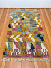 Handwoven Moroccan Bjaad carpet with checker and chevron geometric design in multicolor wool, 267 × 155 cm