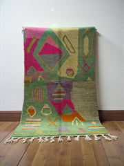 Handwoven Moroccan Bjaad carpet with abstract garden-inspired geometric motifs in multicolor wool, 250 × 150 cm