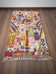 Handwoven Moroccan Bjaad carpet with vibrant pink medina-inspired geometric motifs in multicolor wool, 266 × 159 cm