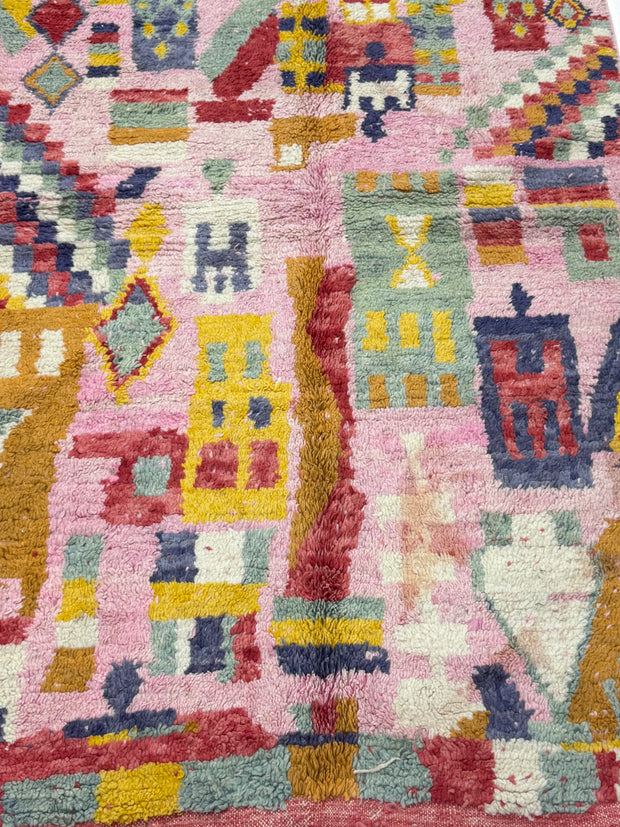 Handwoven Moroccan Bjaad carpet with vibrant pink medina-inspired geometric motifs in multicolor wool, 266 × 159 cm