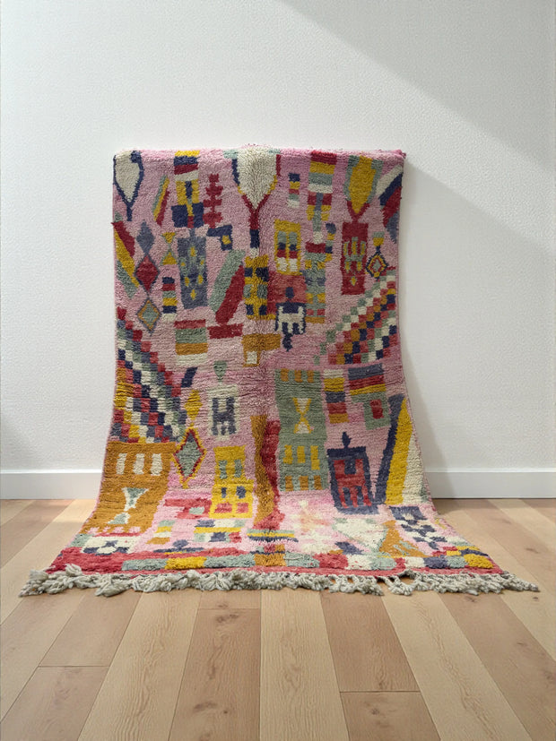Handwoven Moroccan Bjaad carpet with vibrant pink medina-inspired geometric motifs in multicolor wool, 266 × 159 cm