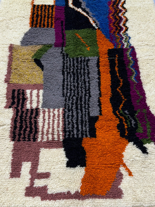Handwoven Moroccan Azilal carpet with abstract earth and sky color-block pattern in natural wool, 255 × 137 cm
