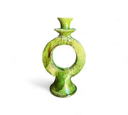 Green ceramic candle holder on a white background