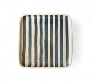 SQUARE ceramic tray with blue and white vertical stripes on a white background