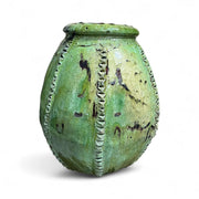 Green textured urn on a white background