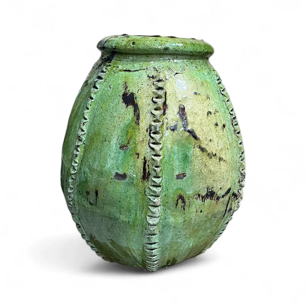 Green textured urn on a white background