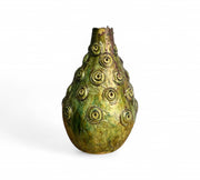 Decorative vase with circular patterns on a white background