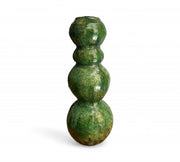 Green ceramic vase with three spherical sections on a white background