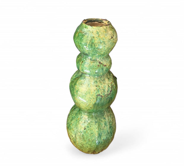 Green ceramic candle holder on a white background