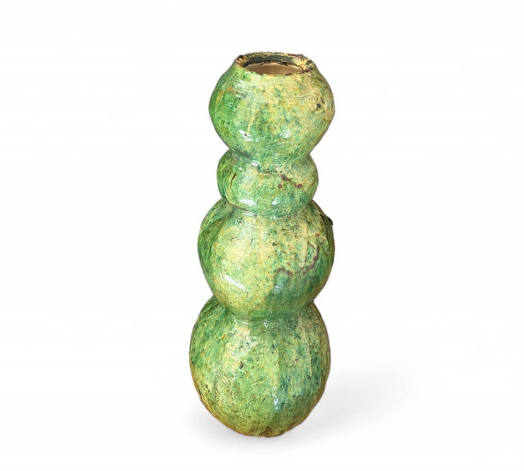Green ceramic candle holder on a white background