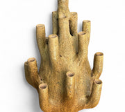 Ceramic coral-like sculpture on a white background