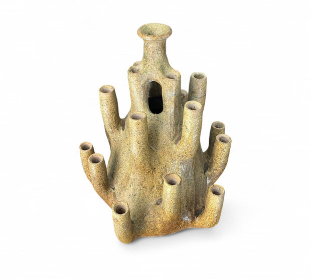 Ceramic coral-like structure with multiple nooks on a white background