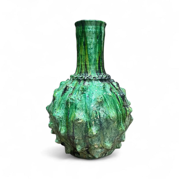 Green textured vase on a white background