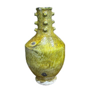 Yellow ceramic vase with textured design on a white background