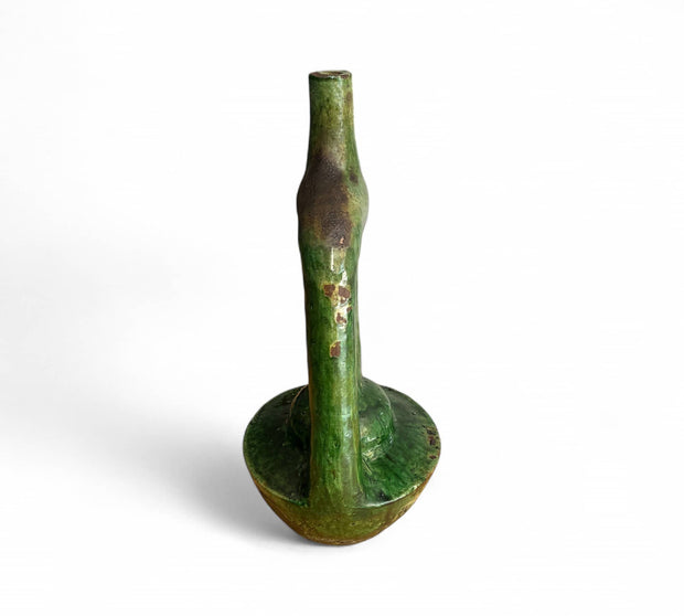 Green ceramic vase on a white background