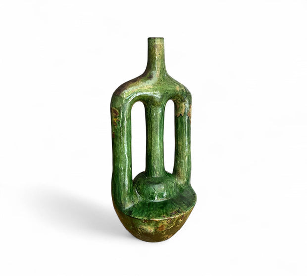 Green ceramic vase on a white background