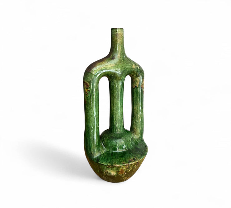Green ceramic vase on a white background
